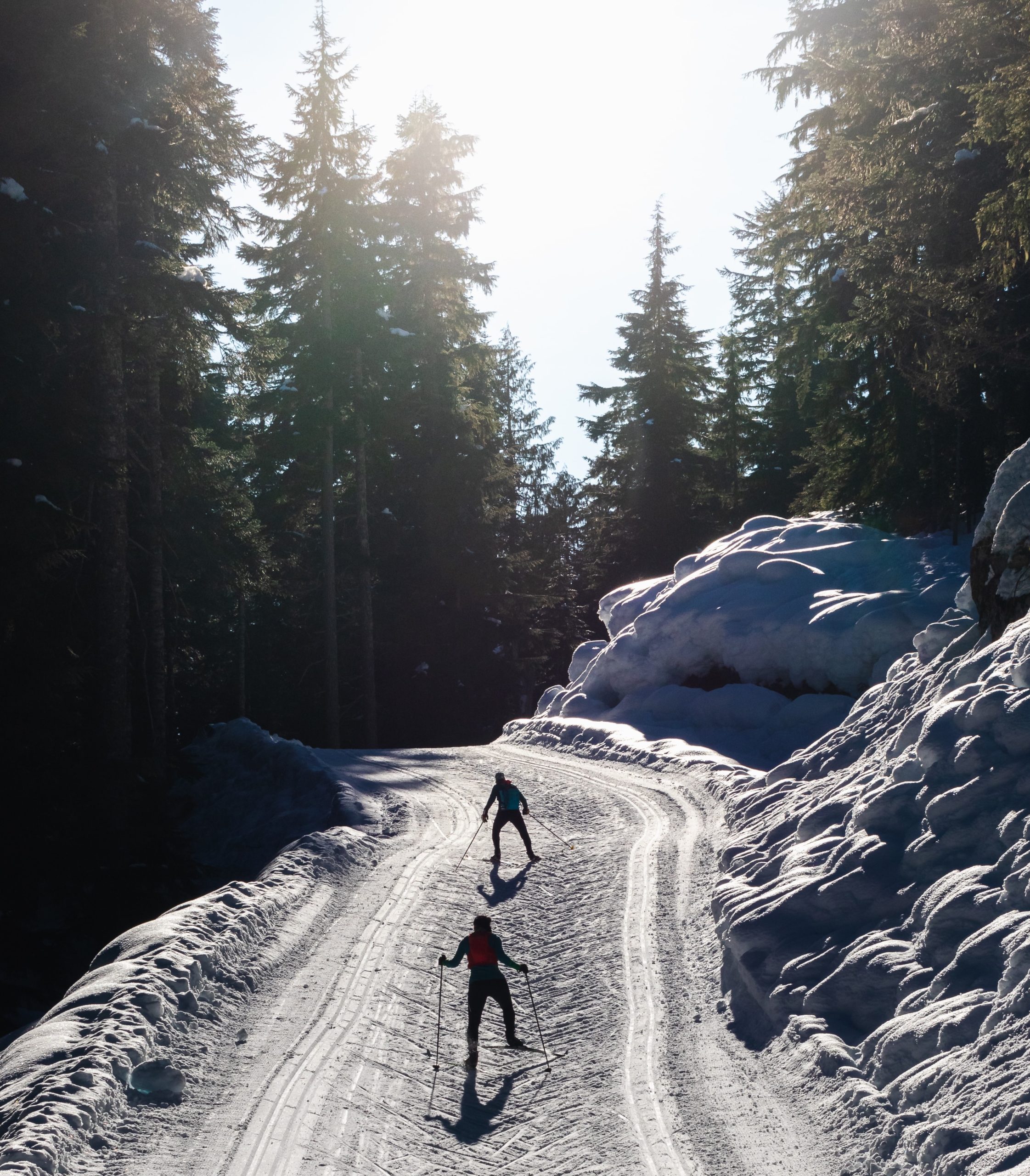 two cross country skiers skate skiing